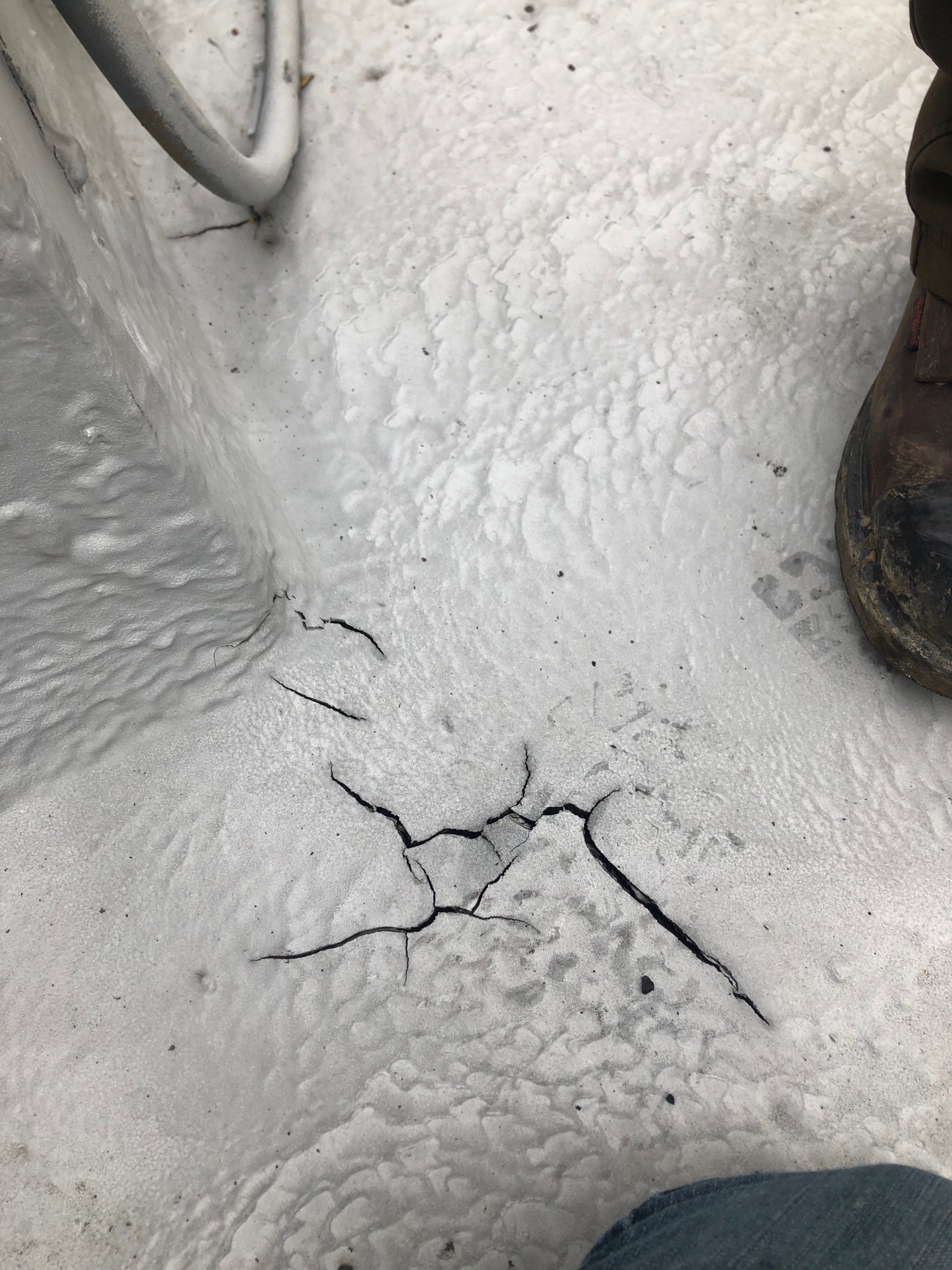 Seamless traffic-bearing coating applied over a deck surface