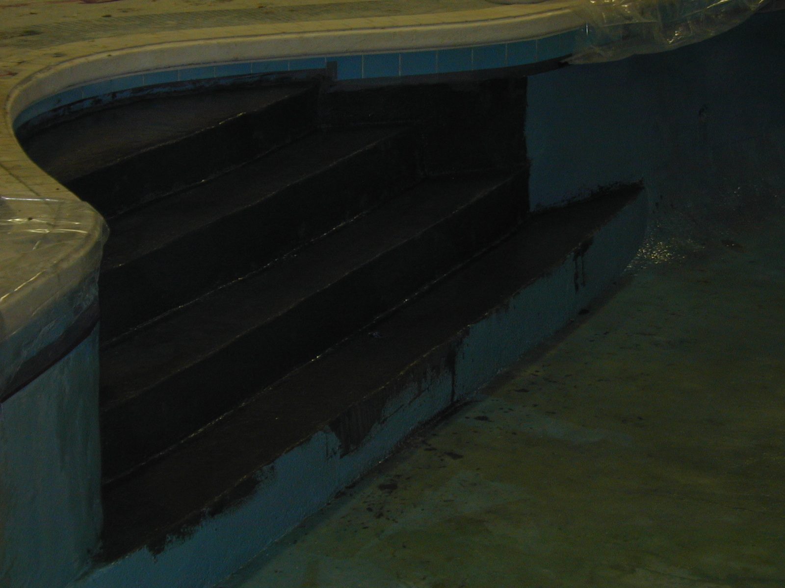 Waterproof deck membrane installed over a trafficked surface